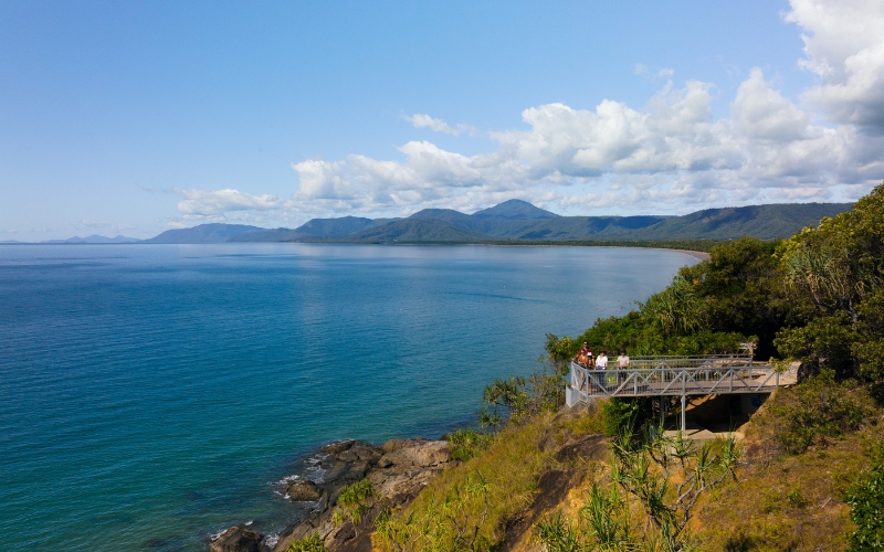 Visitors enjoying panoramic coastal views from Flagstaff Hill Lookout in Port Douglas, one of the best land-based whale watching spots.